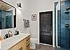Enjoy the convenience of a walk-in shower in this well-appointed bathroom.

