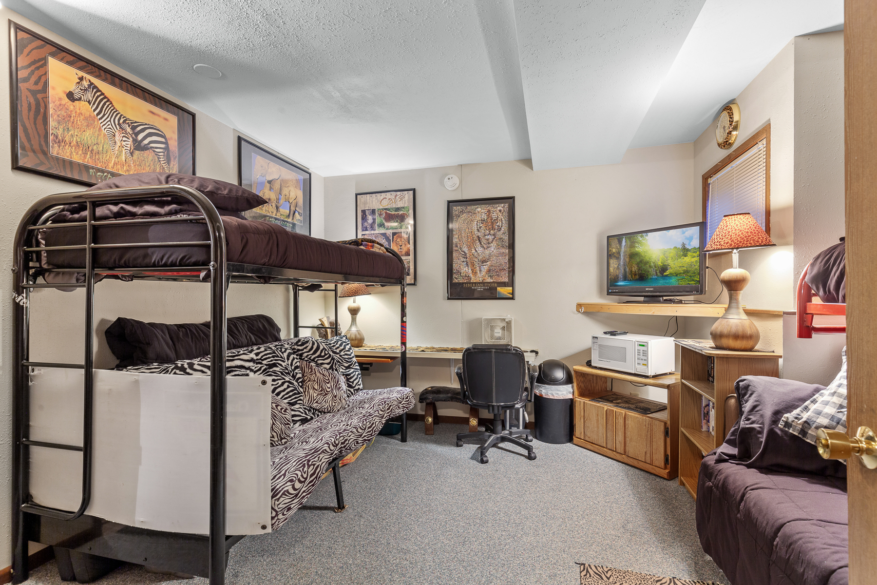 One full size bed, two (2) twin beds and futon couch