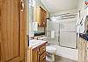 Second shared full bath with tub/shower combo.