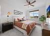 King Bedroom #1 with an overhead and Smart TV