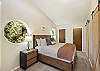 King bedroom with ensuite bathroom with walk-in shower.