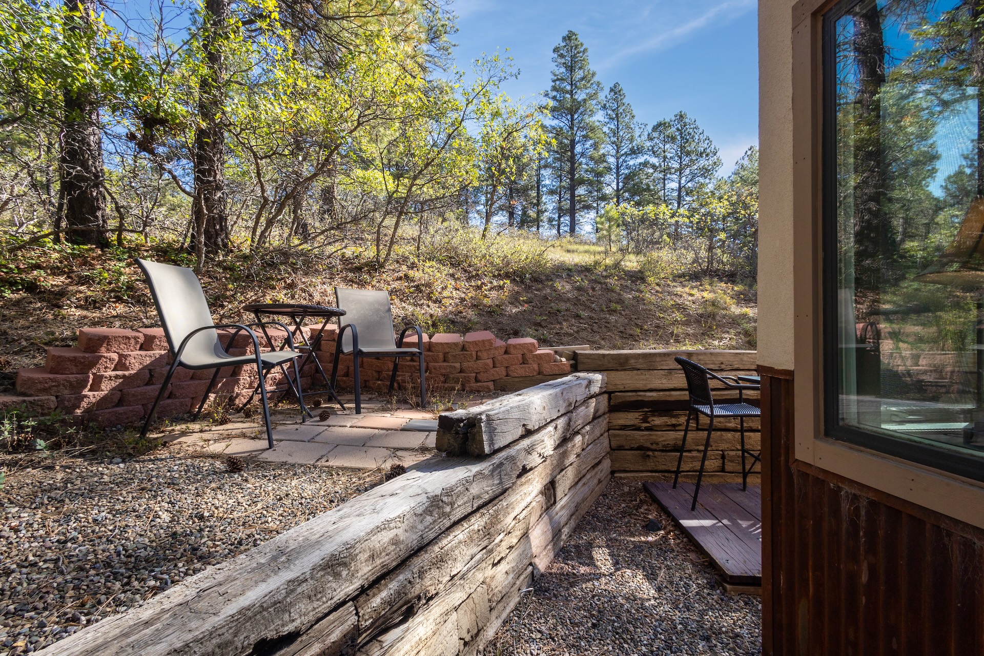 Back patio surrounded by nature.