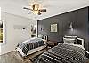 Second bedroom with two (2) twin beds and smart TV.