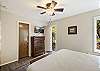 King bedroom with outdoor access, ensuite bathroom and Smart TV. 