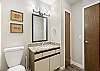 Main level hall bathroom with tub/shower combo. 