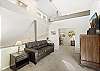 Upstairs loft area with Smart TV and sleeper sofa, open to the living room below. 