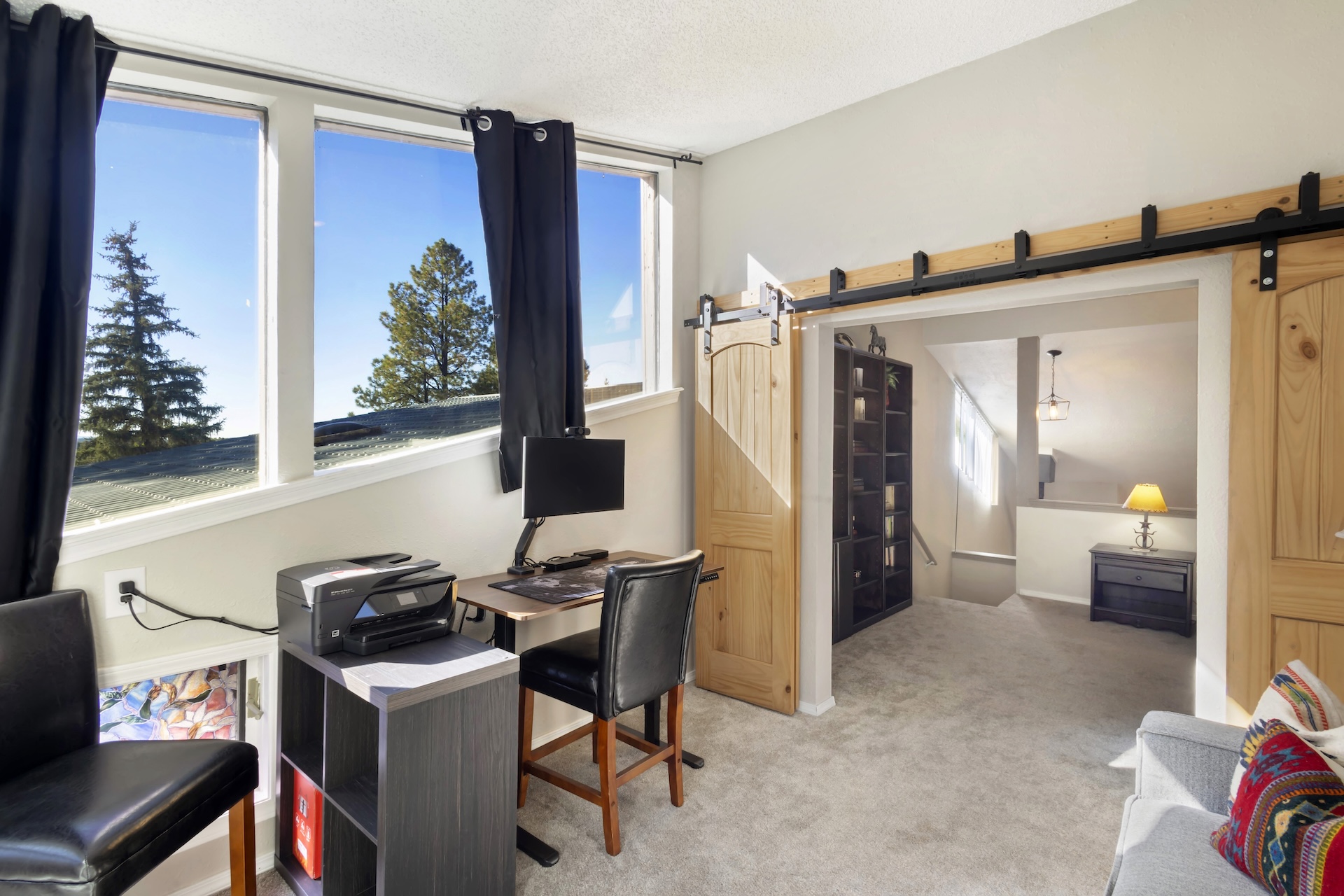 Office space with monitor and printer. Peekaboo views of Pagos Lake.