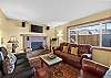 Cozy living room with plenty of seating. Please note the fireplace is not operational