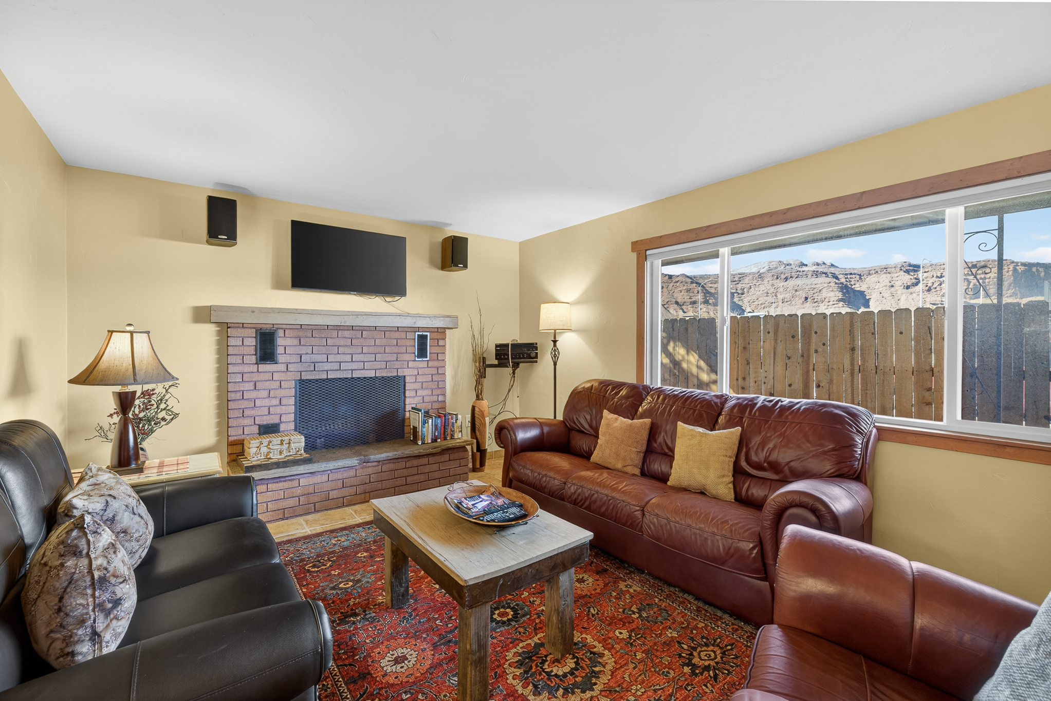 Cozy living room with plenty of seating. Please note the fireplace is not operational