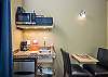 Kitchenette with a microwave, mini fridge, coffee maker, sink, and dining area