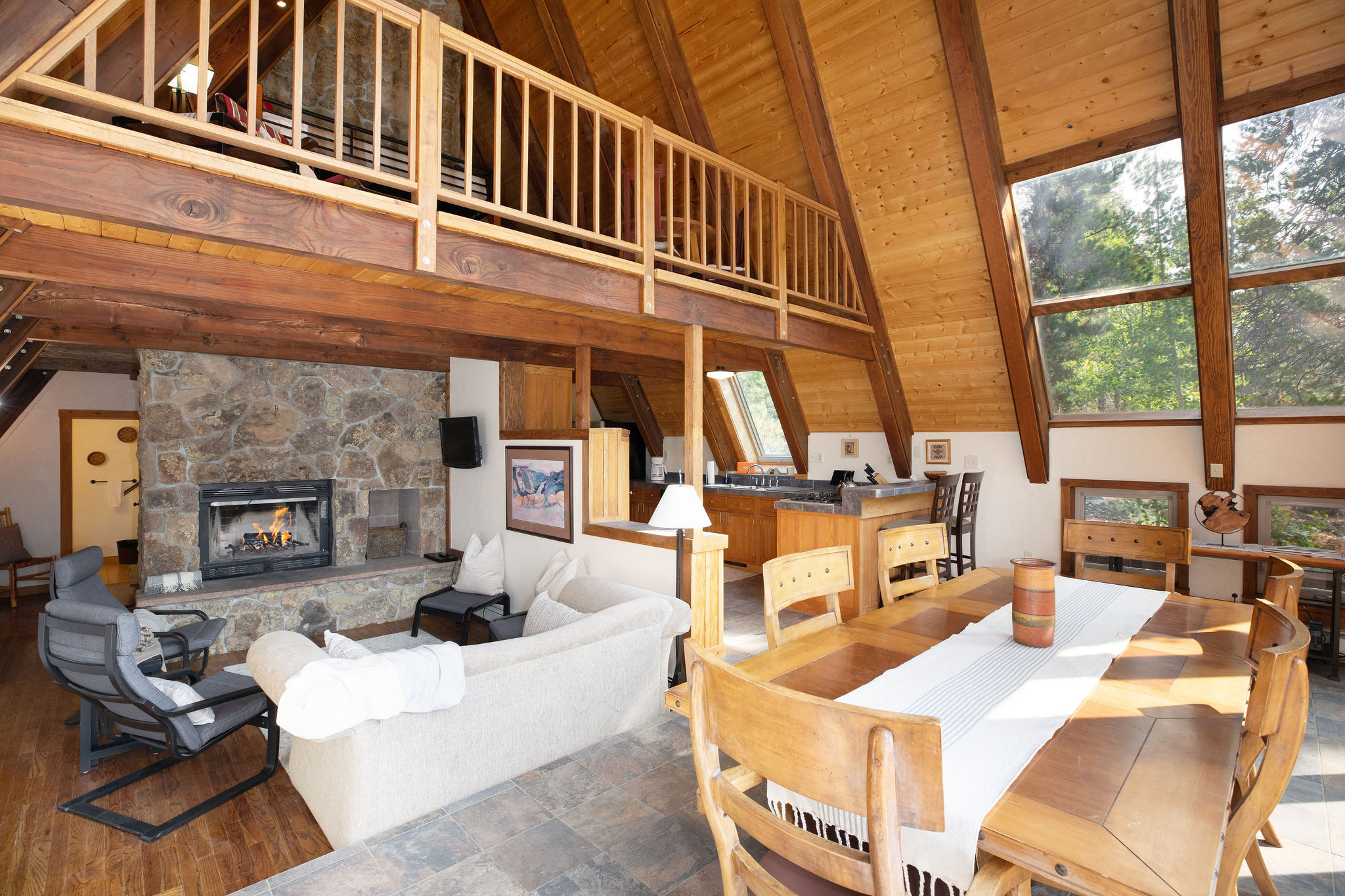 Open concept living room with a fireplace and plush seating
