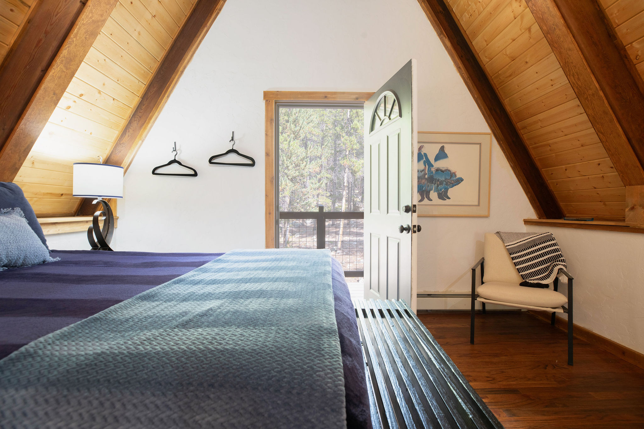 Queen bedroom #1 with private deck and ensuite bathroom - located on the main floor