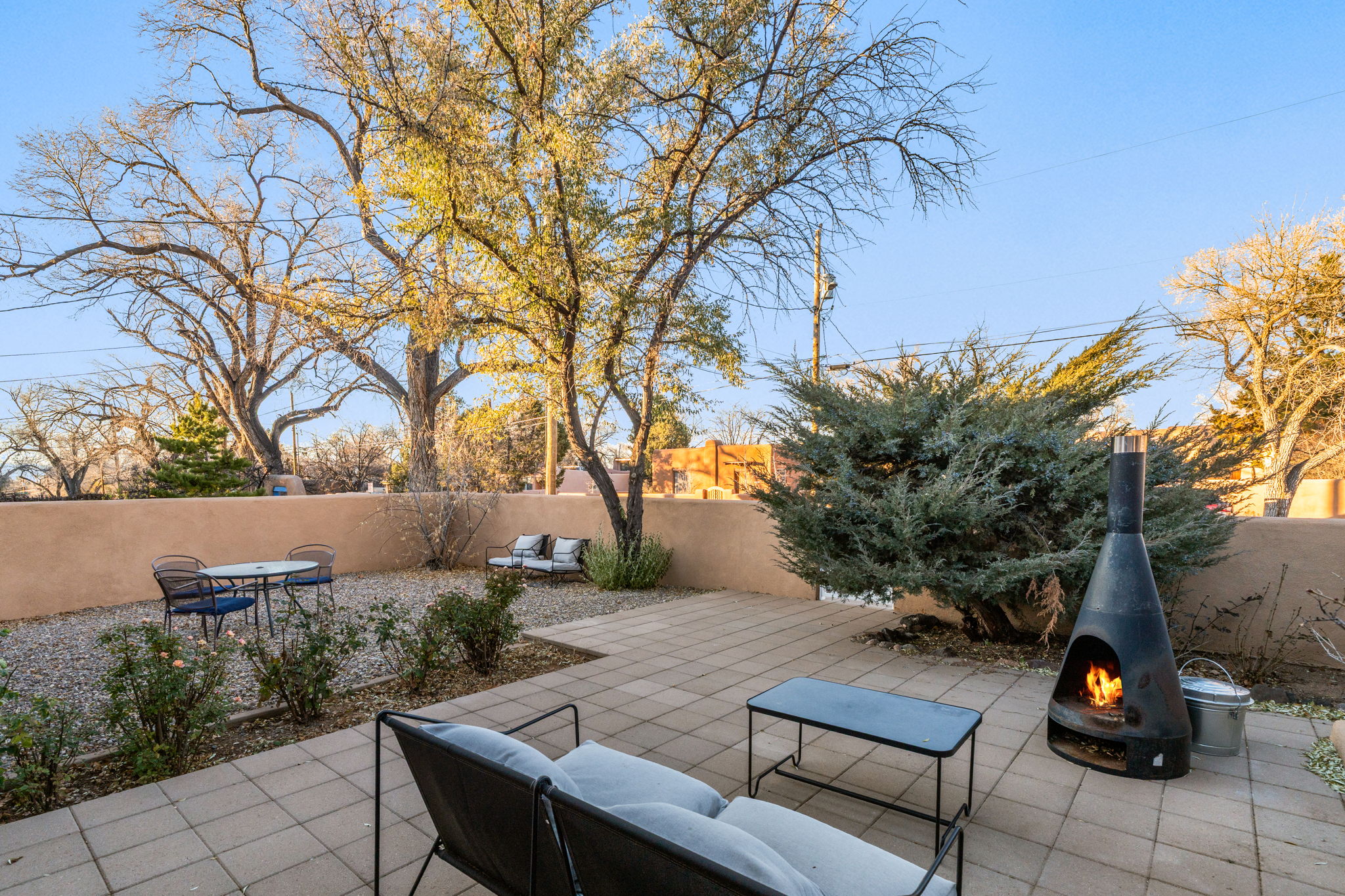 Relax by the fire pit in your fully fenced front yard -perfect for Santa Fe evenings under the stars