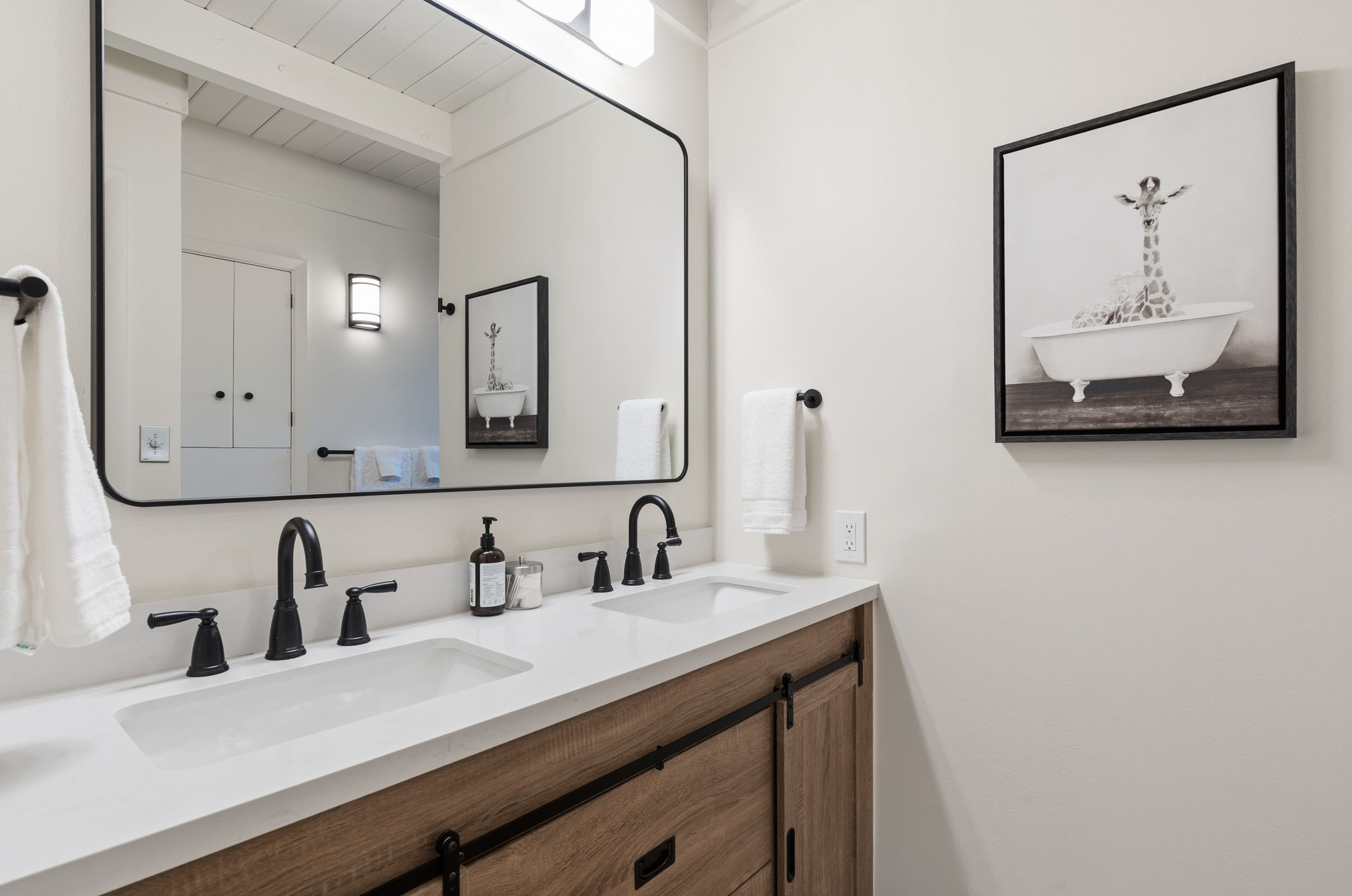 Full bathroom features walk-in shower with modern finishes and clean contemporary design