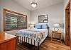 Relax and recharge in this cozy queen bedroom retreat.

