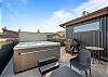 Your private rooftop oasis - a BBQ grill, seating, and a hot tub