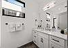 Fresh and functional full bathroom with a walk-in shower and contemporary design.
