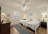 Second bedroom - Two (2) Twin beds with an overhead fan and TV