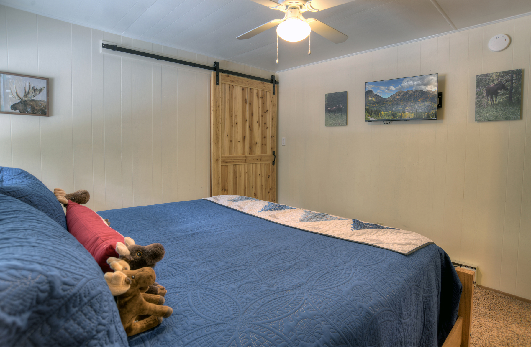 Bedroom 3 additional view showing comfortable king bed with rustic furnishings and mountain lodge charm.