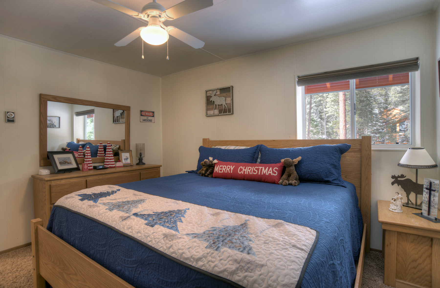 Bedroom 3: King bed on main level with Smart TV. Full bathroom in hallway. Cozy and comfortable.