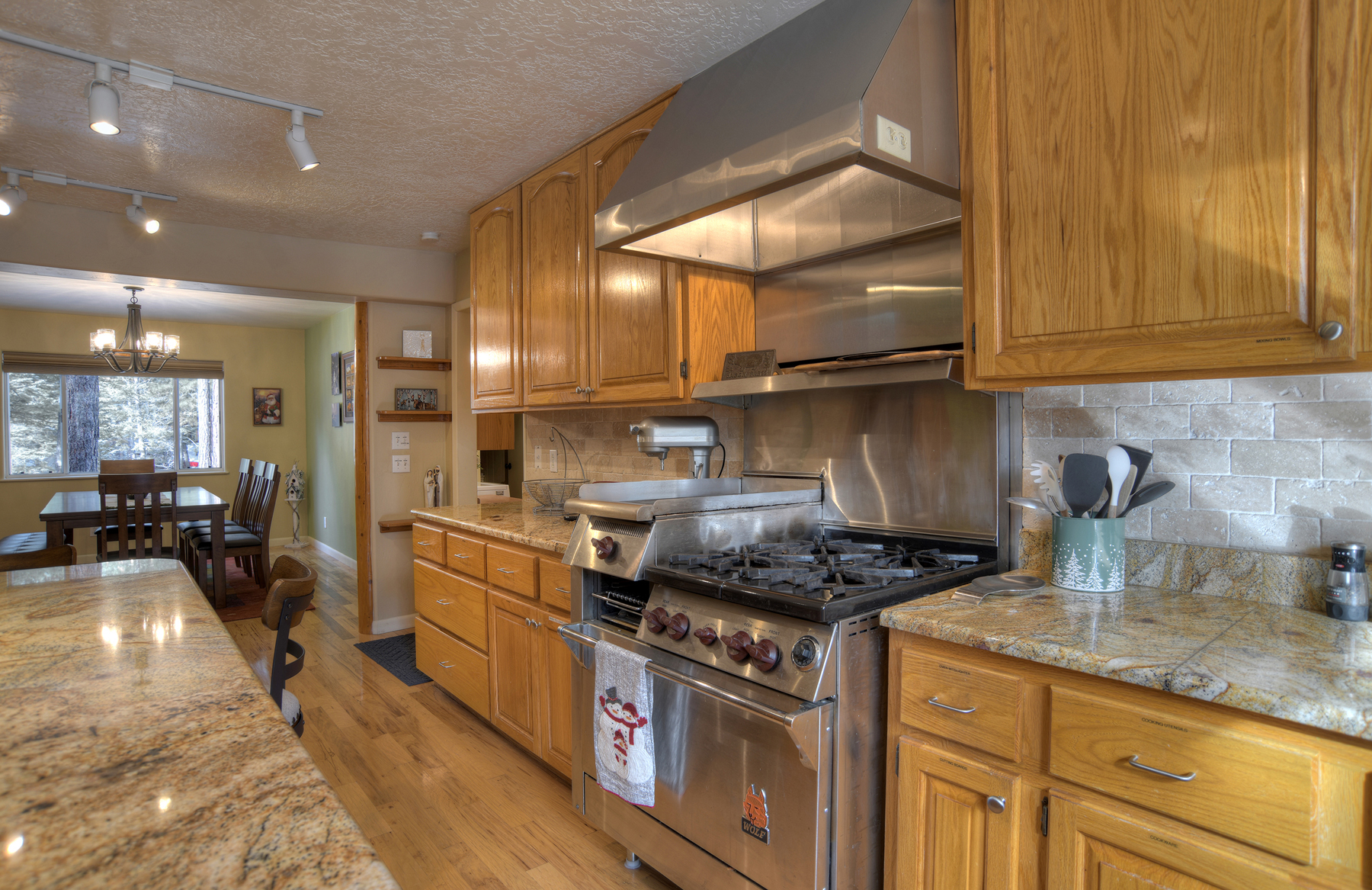 Bright kitchen and dining area that keeps everyone connected while cooking.