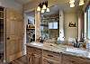 Ensuite bathroom with dual vanities and a walk-in shower