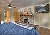 Master bedroom with king bed, fireplace, and ensuite bathroom. Smart TV for relaxation.