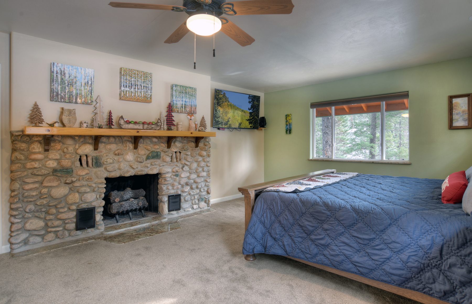 Bedroom 1: King bed with fireplace, ensuite bathroom, and Smart TV. Comfortable retreat on Level 4.