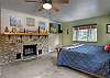 Bedroom 1: King bed with fireplace, ensuite bathroom, and Smart TV. Comfortable retreat on Level 4.
