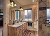 Ensuite bathroom with dual vanities and a walk-in shower