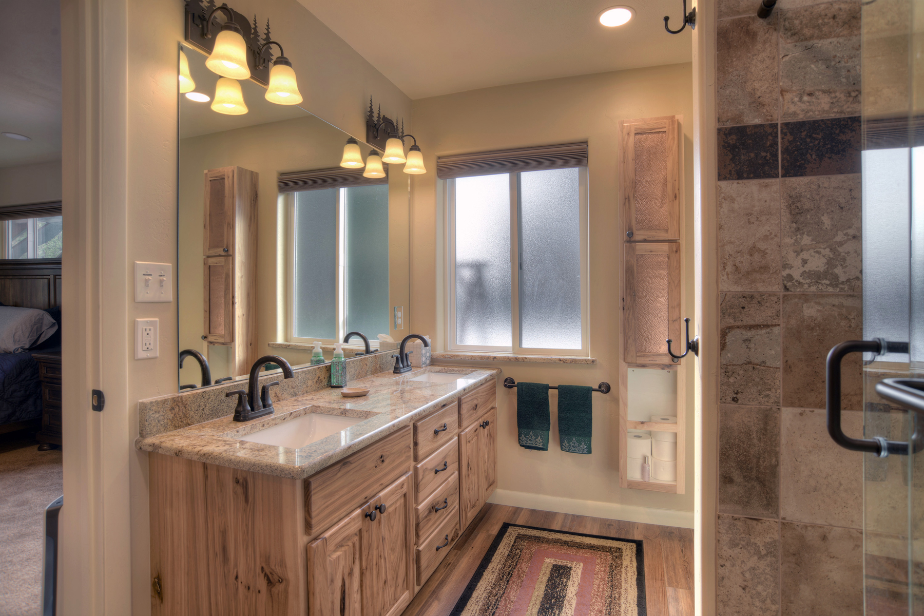 Ensuite bathroom with dual vanities and a walk-in shower
