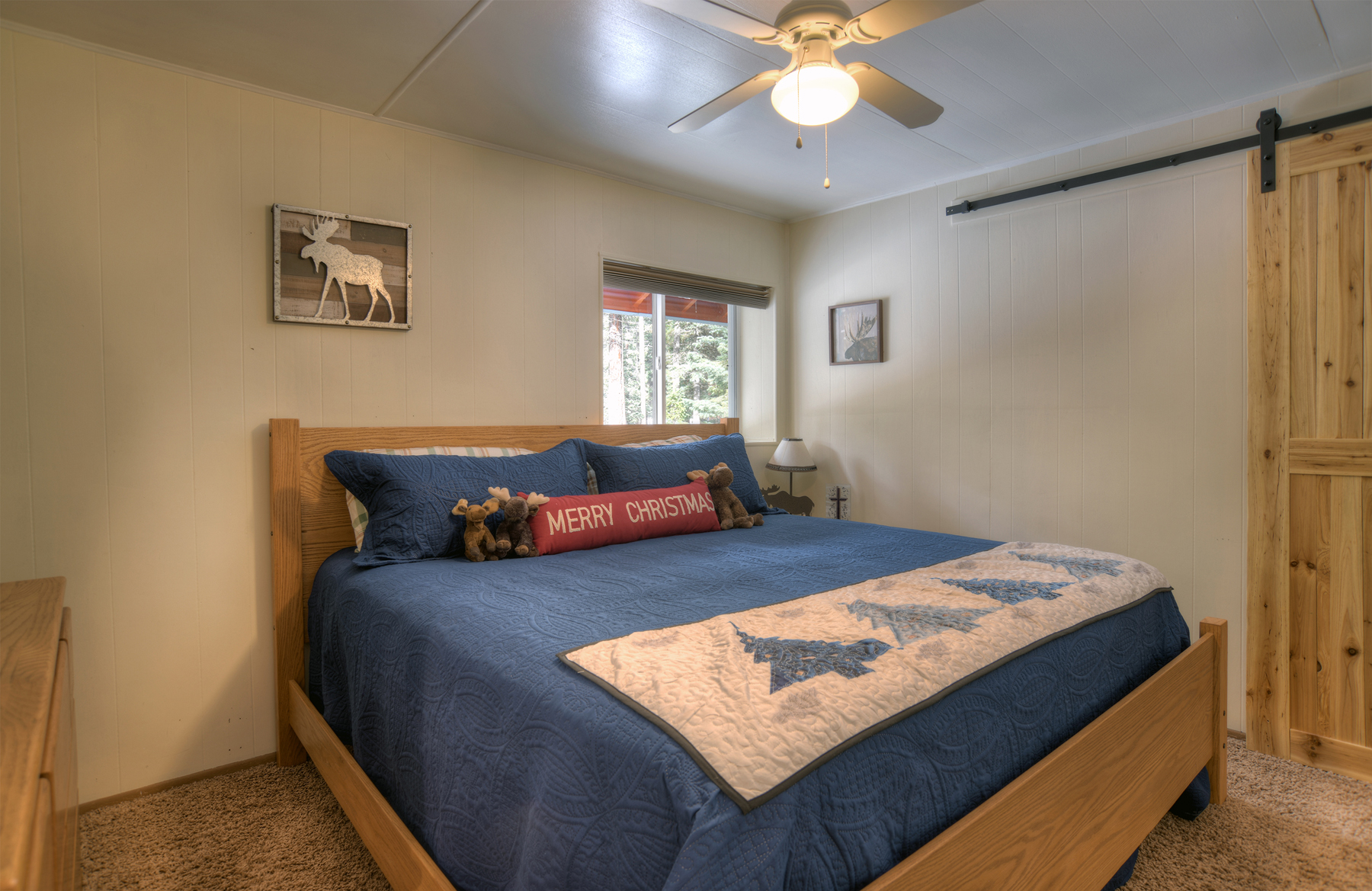 Bedroom 3 ensuite view. Comfortable bedroom with warm natural wood finishings and peaceful setting.