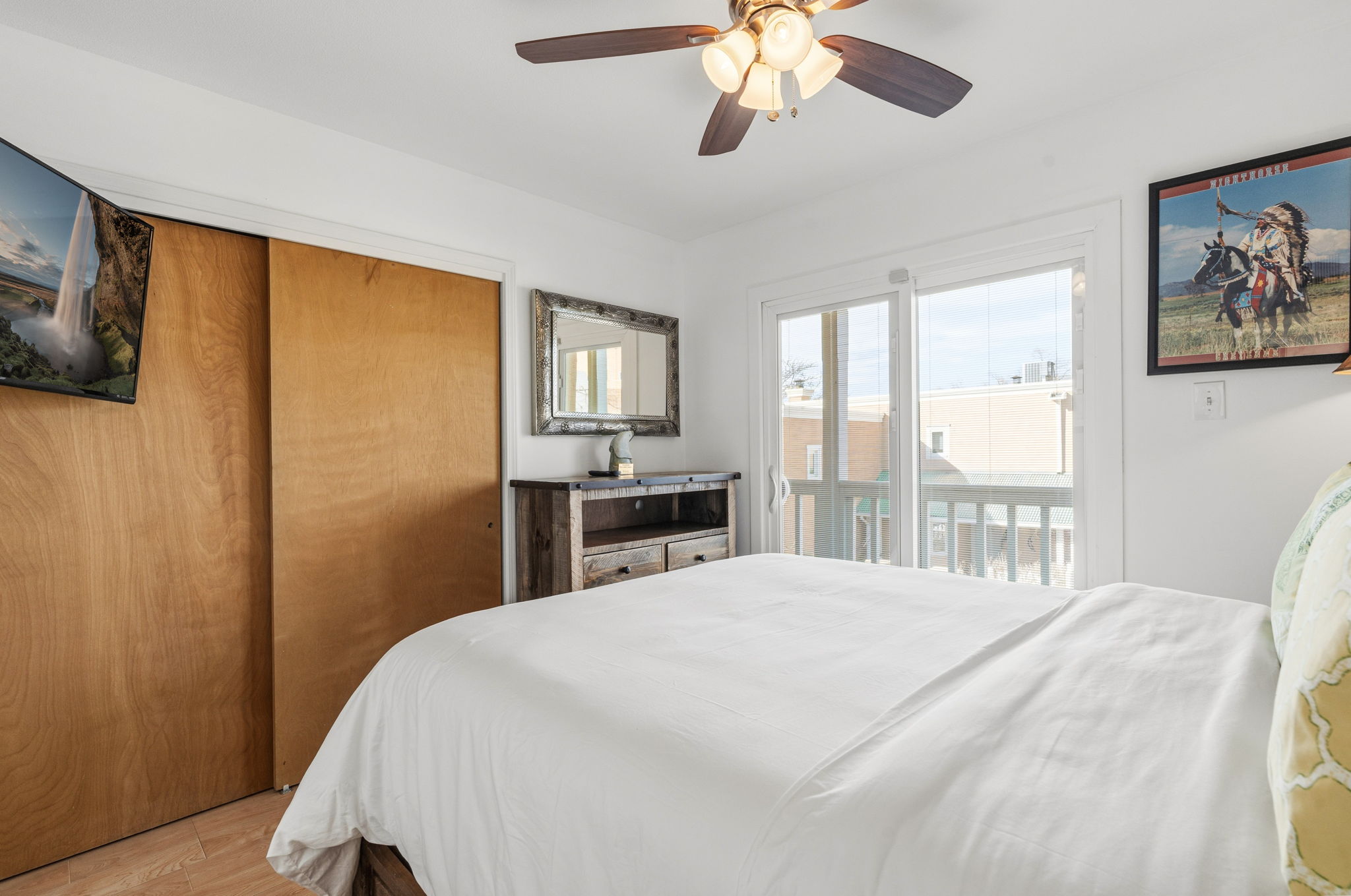 Queen bedroom #2 with balcony access and a smart TV