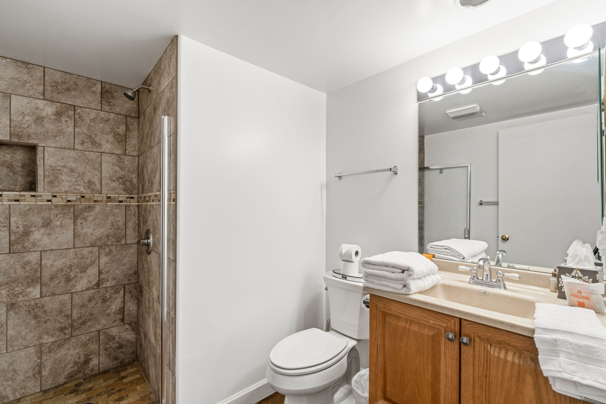 Full bathroom #1 featuring a sleek walk-in shower.
