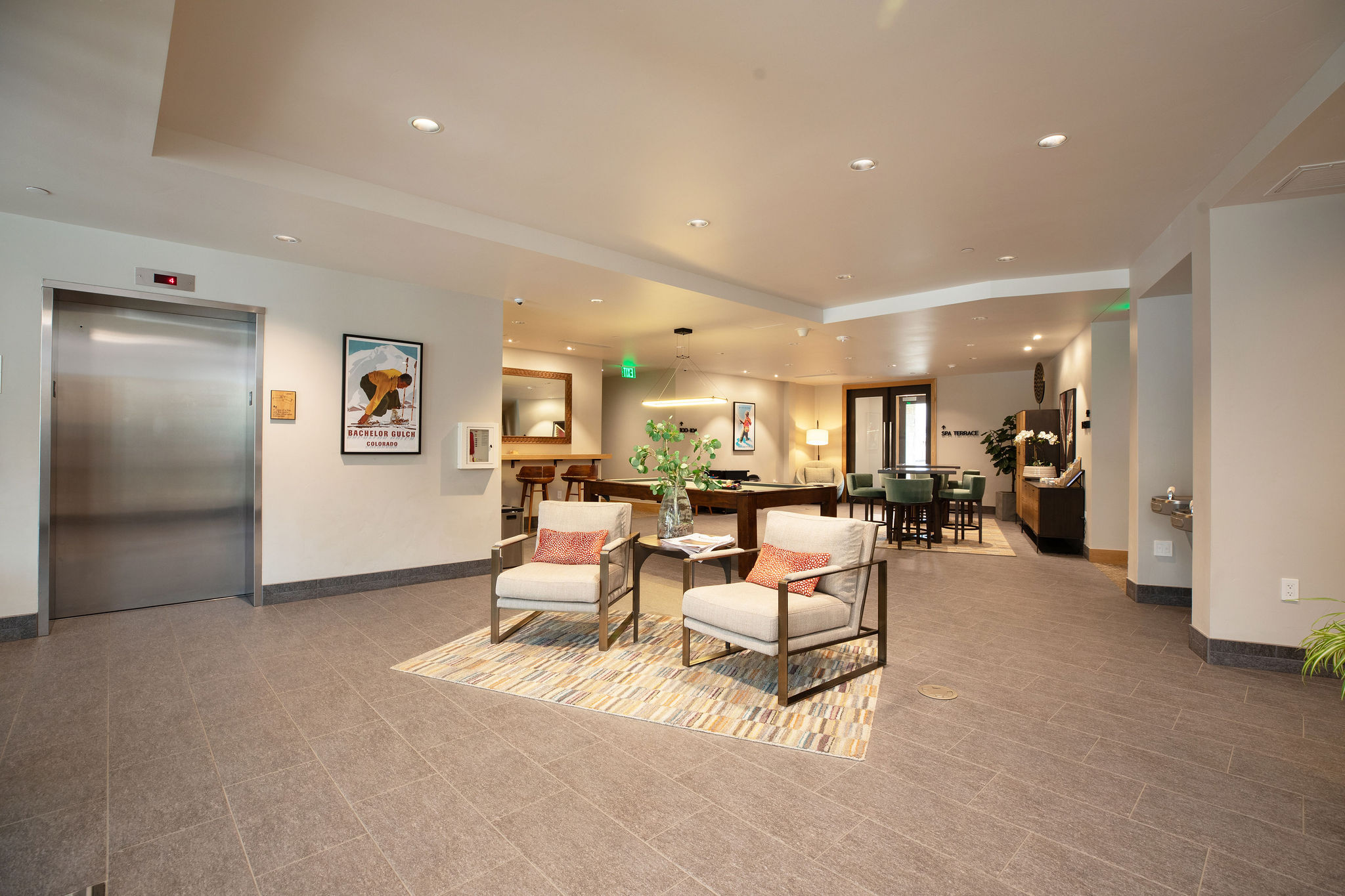 Shared lounge space with pool table and seating—great for meeting other guests