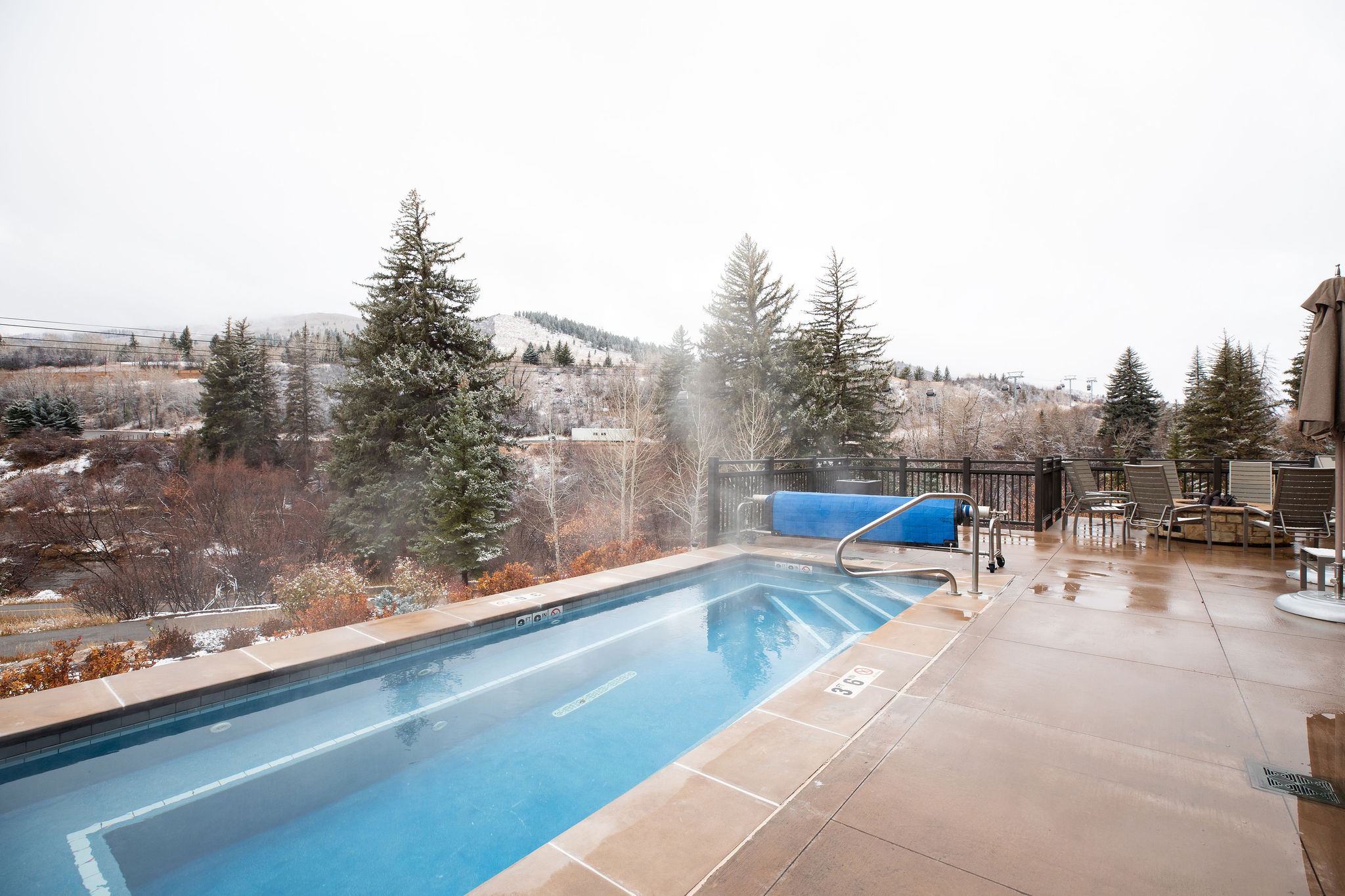 Soak in the outdoor hot tubs with mountain views—one of many perks with amenity access