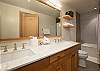 Second full bathroom features a tub-shower combo and contemporary mountain style