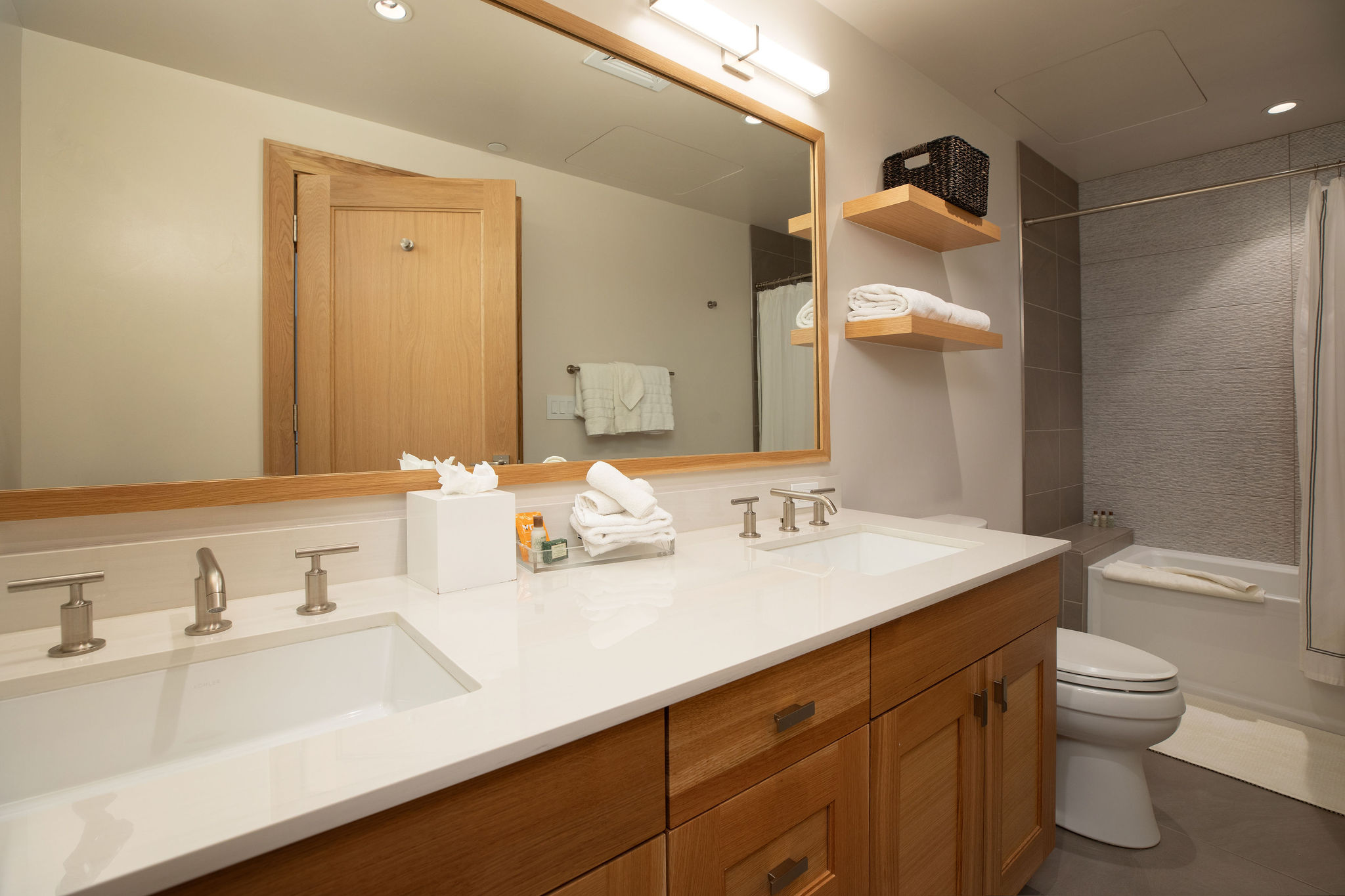 Second full bathroom features a tub-shower combo and contemporary mountain style