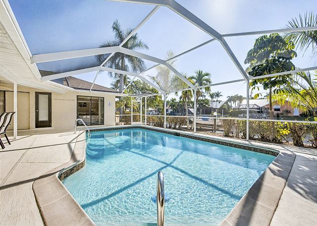 New Listing! Canalfront Comfort | Heated Pool, Patio & Palm-Lined Views 3