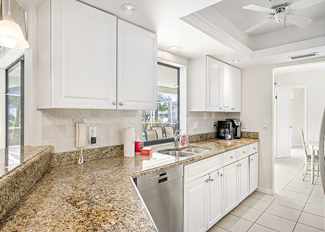 New Listing! Canalfront Comfort | Heated Pool, Patio & Palm-Lined Views 9