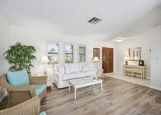 New Listing! Canalfront Comfort | Heated Pool, Patio & Palm-Lined Views 6