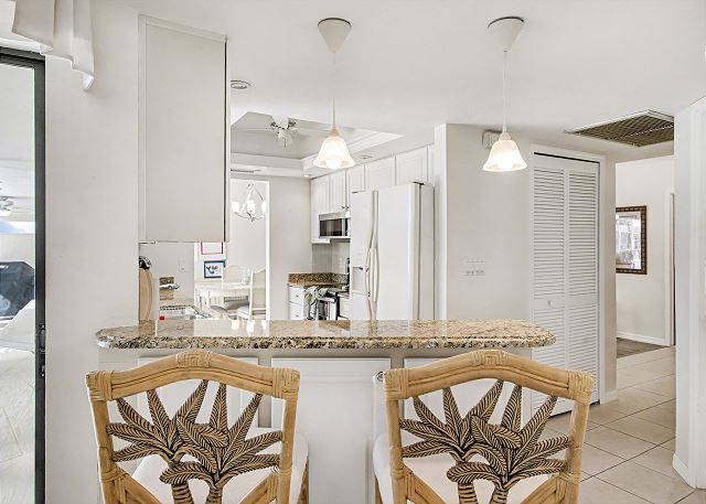 New Listing! Canalfront Comfort | Heated Pool, Patio & Palm-Lined Views 10