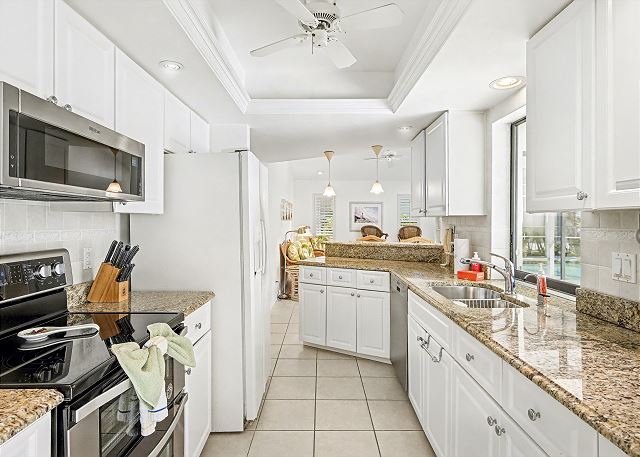 New Listing! Canalfront Comfort | Heated Pool, Patio & Palm-Lined Views 8