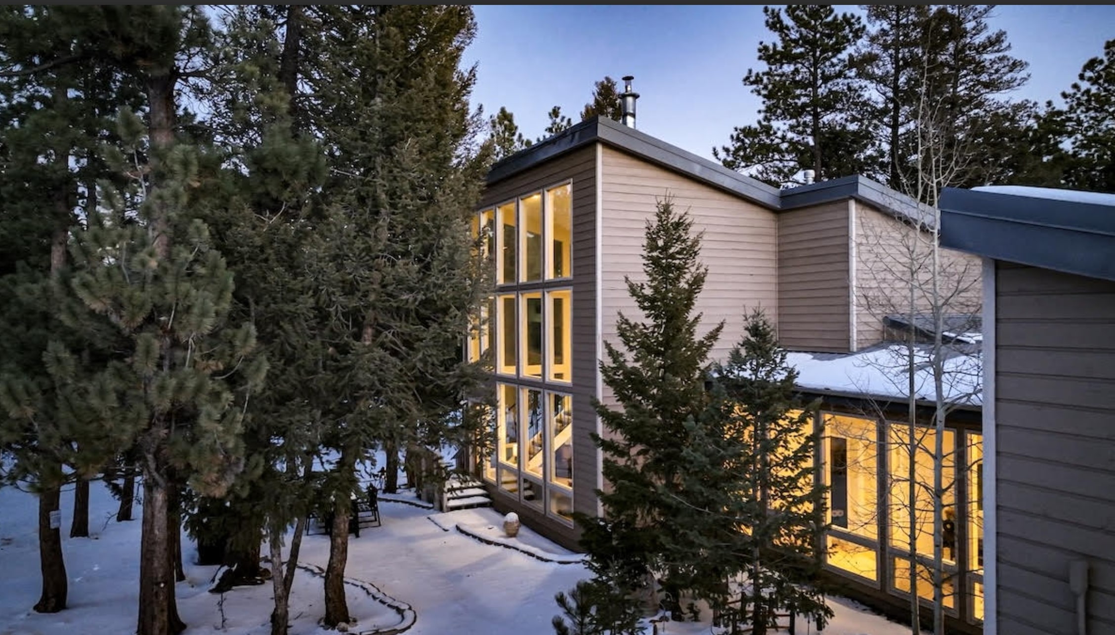 Welcome to your modern mountain escape - arcade games, a private hot tub, and floor-to-ceiling windows.