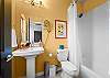 Bright bathroom with modern fixtures and colorful accents