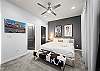 Queen bedroom with Smart TV and ensuite bathroom—one of three private ensuites in this home