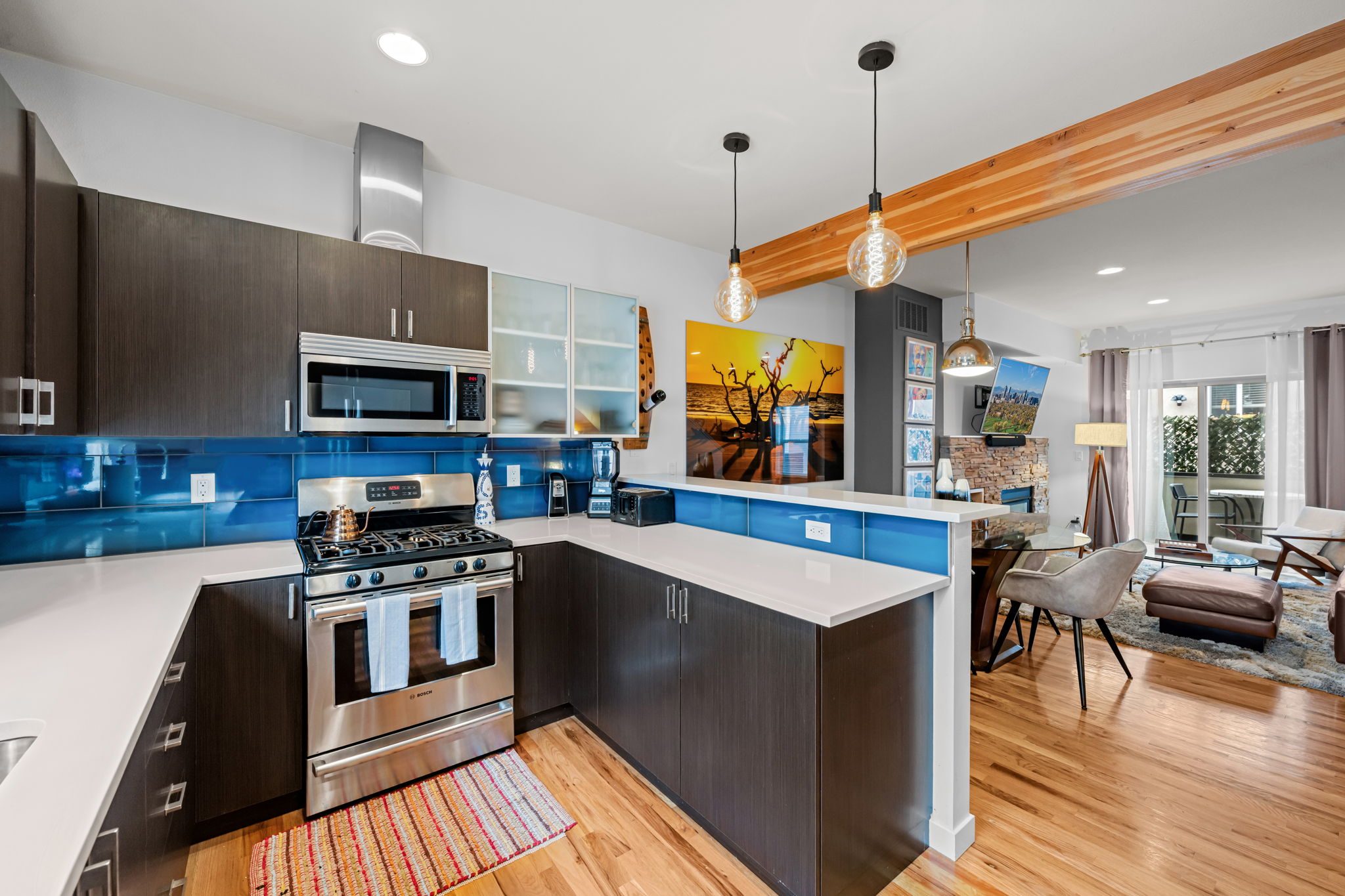 Bright living and dining area with open layout connecting kitchen—ideal for extended stays and remote work