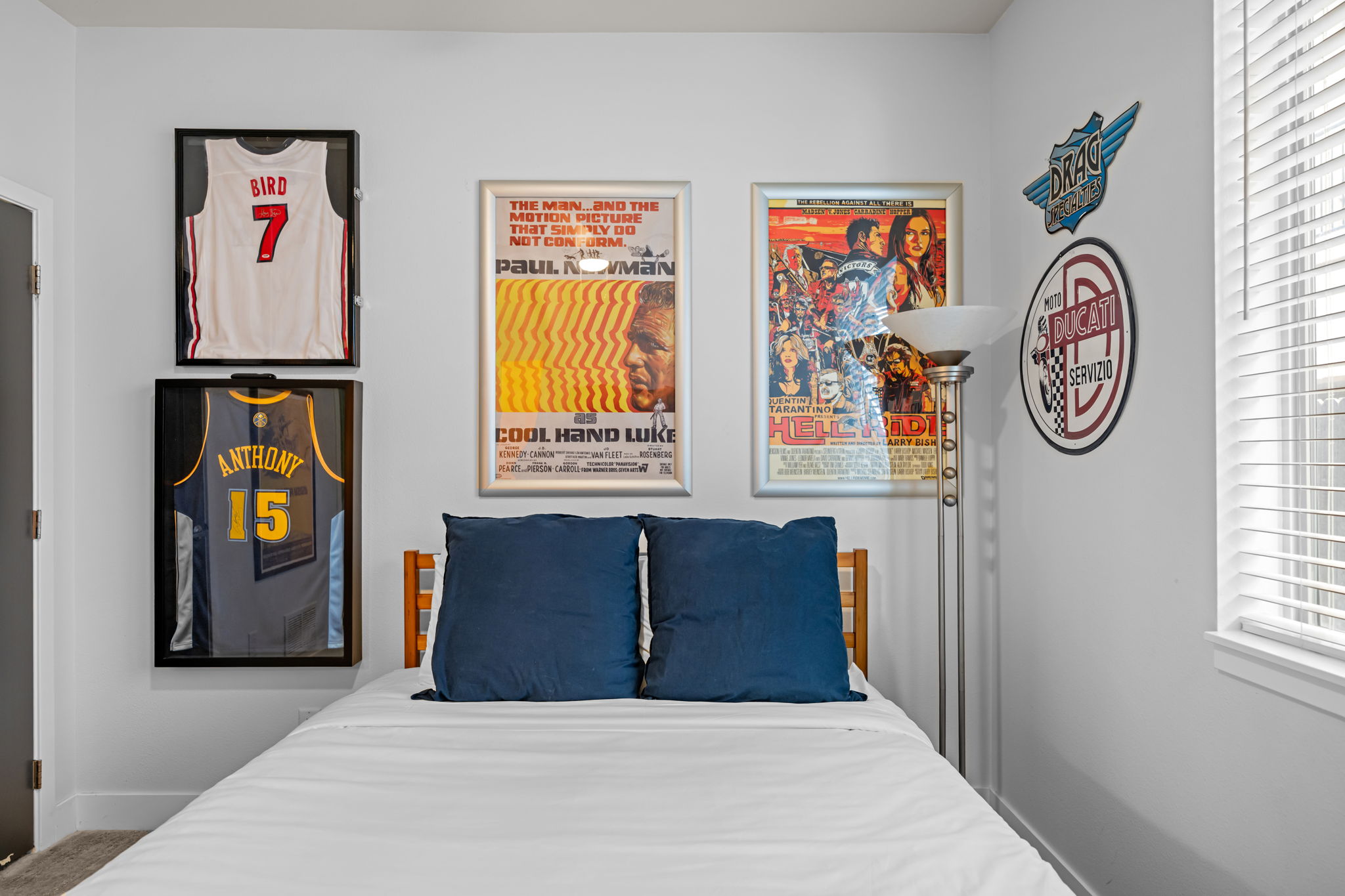 Second queen bedroom with colorful artwork and Smart TV—comfortable space for guests
