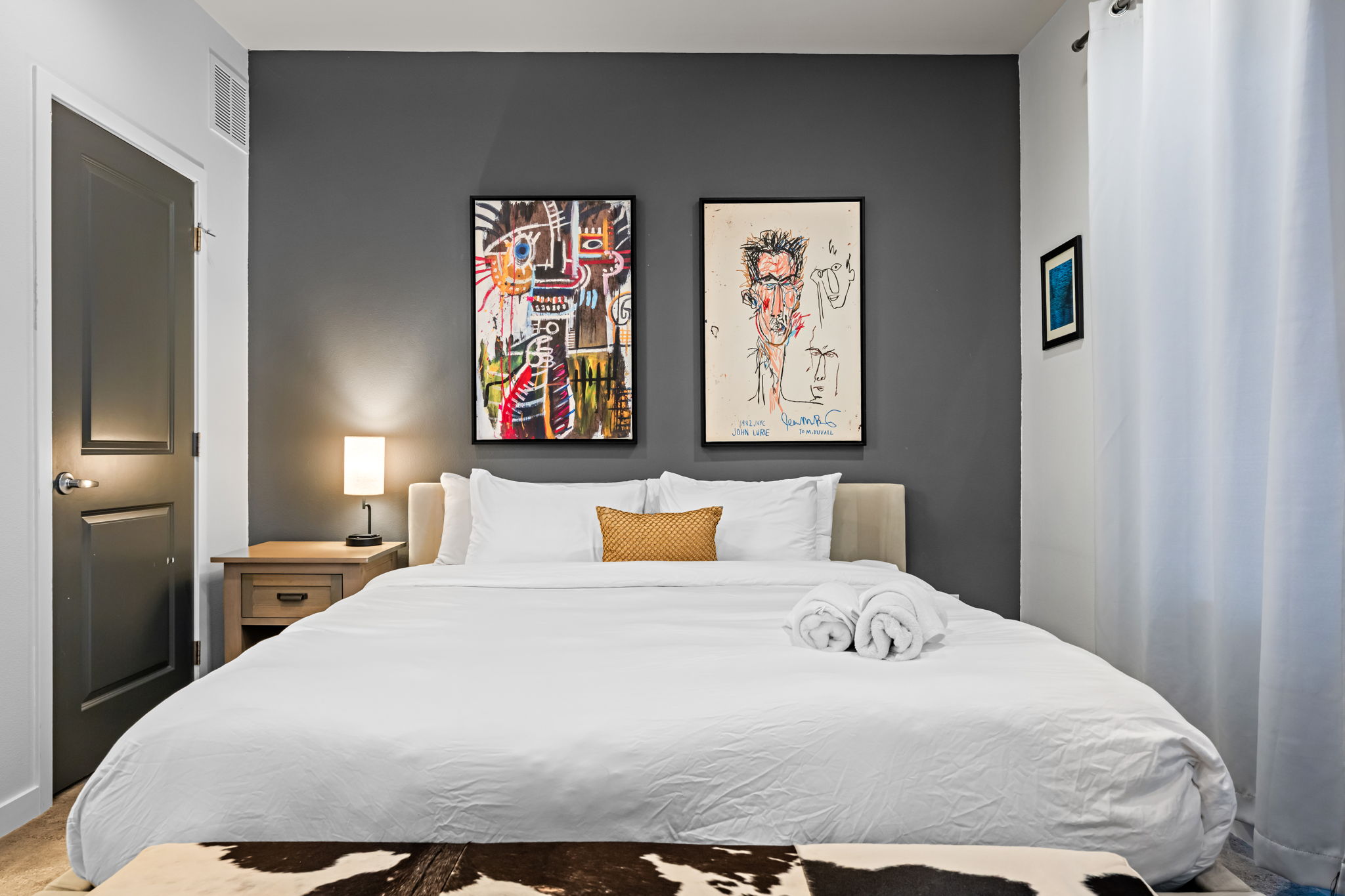 Primary king bedroom with ensuite walk-in shower—your private retreat after a day in the city