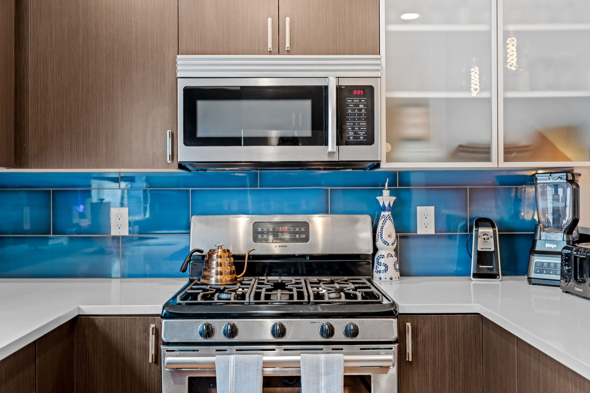 Fully stocked kitchen with modern appliances makes meal prep easy for extended stays